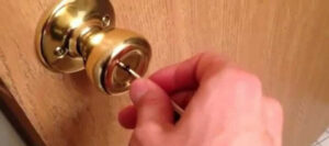 how to unlock a door with a pinhole
